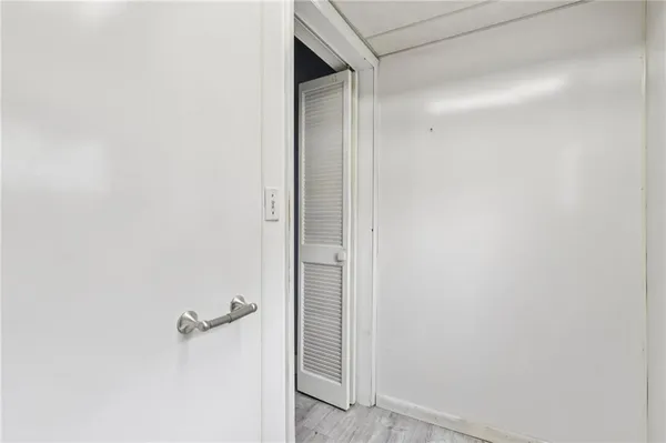a bathroom with a glass shower door