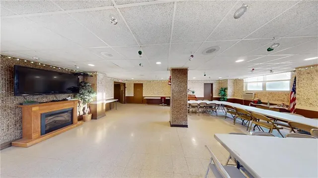 a view of a livingroom with furniture and a flat screen tv