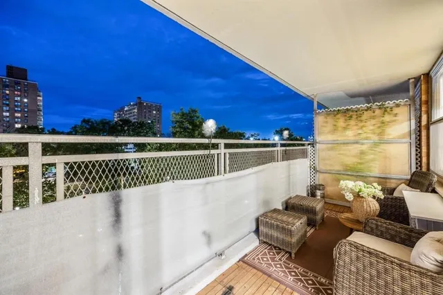 a view of balcony with furniture