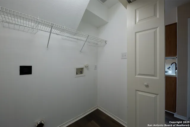 a view of a room with racks on the wall