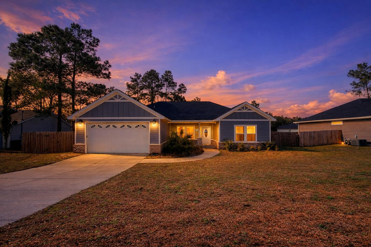 122 Loblolly Circle Midway, FL 32343 - Photo 1 of 38 a front view of a house with a yard and garage