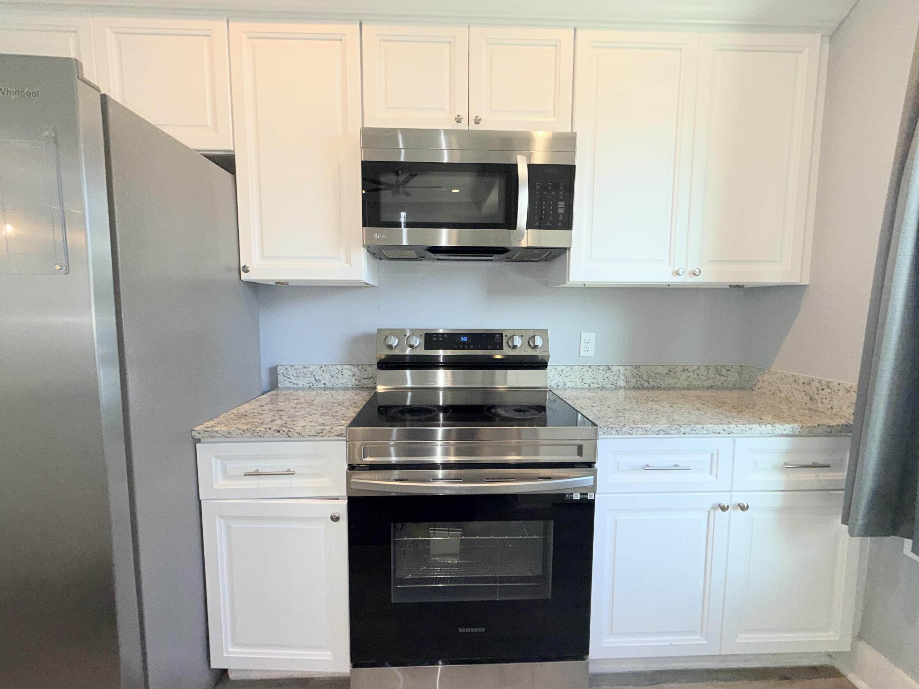 122 Loblolly Circle Midway, FL 32343 - Photo 14 of 38 a stove top oven sitting inside of a kitchen
