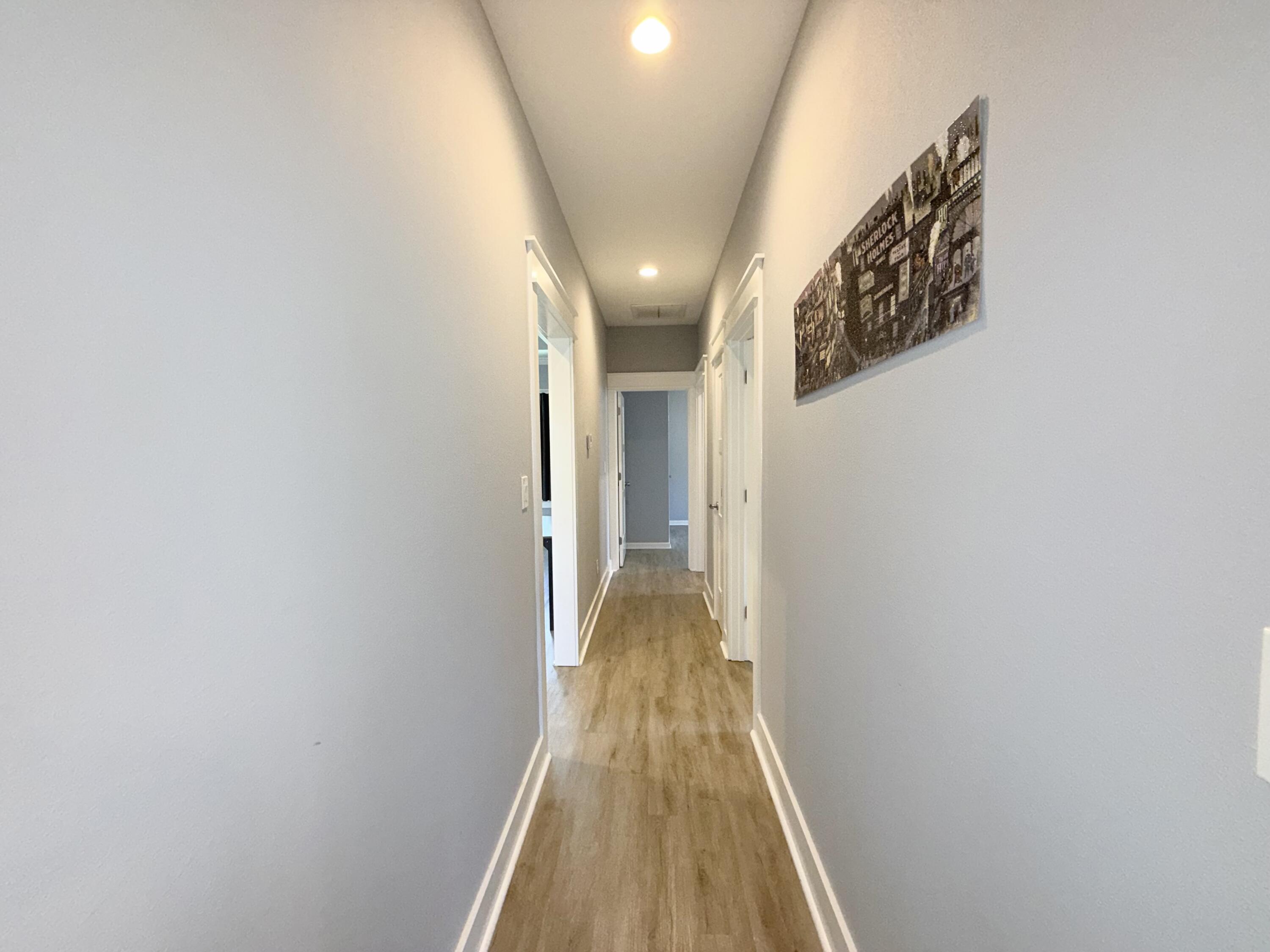122 Loblolly Circle Midway, FL 32343 - Photo 25 of 38 a view of a hallway with wooden floor