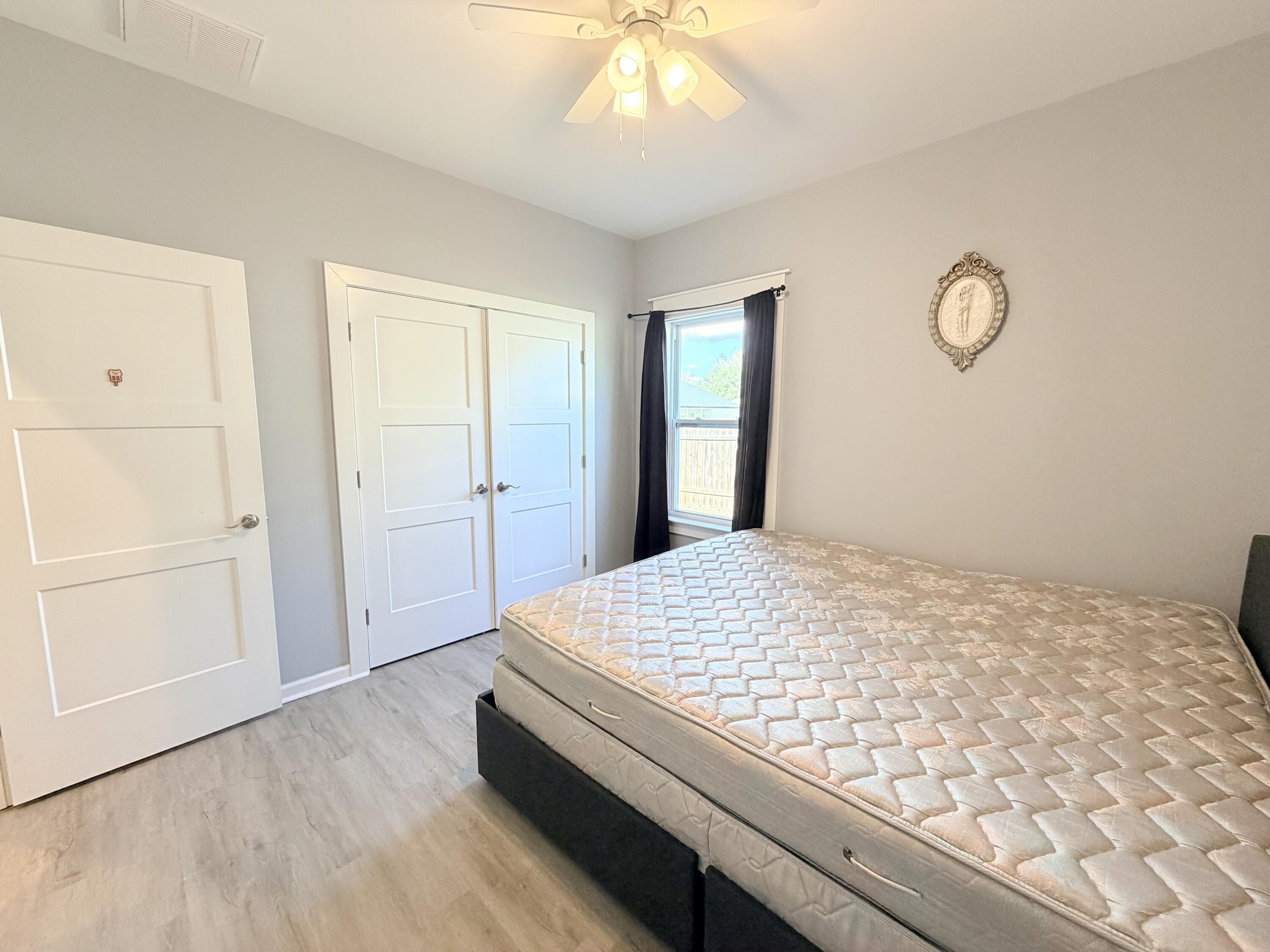 122 Loblolly Circle Midway, FL 32343 - Photo 29 of 38 a bedroom with a bed and a window