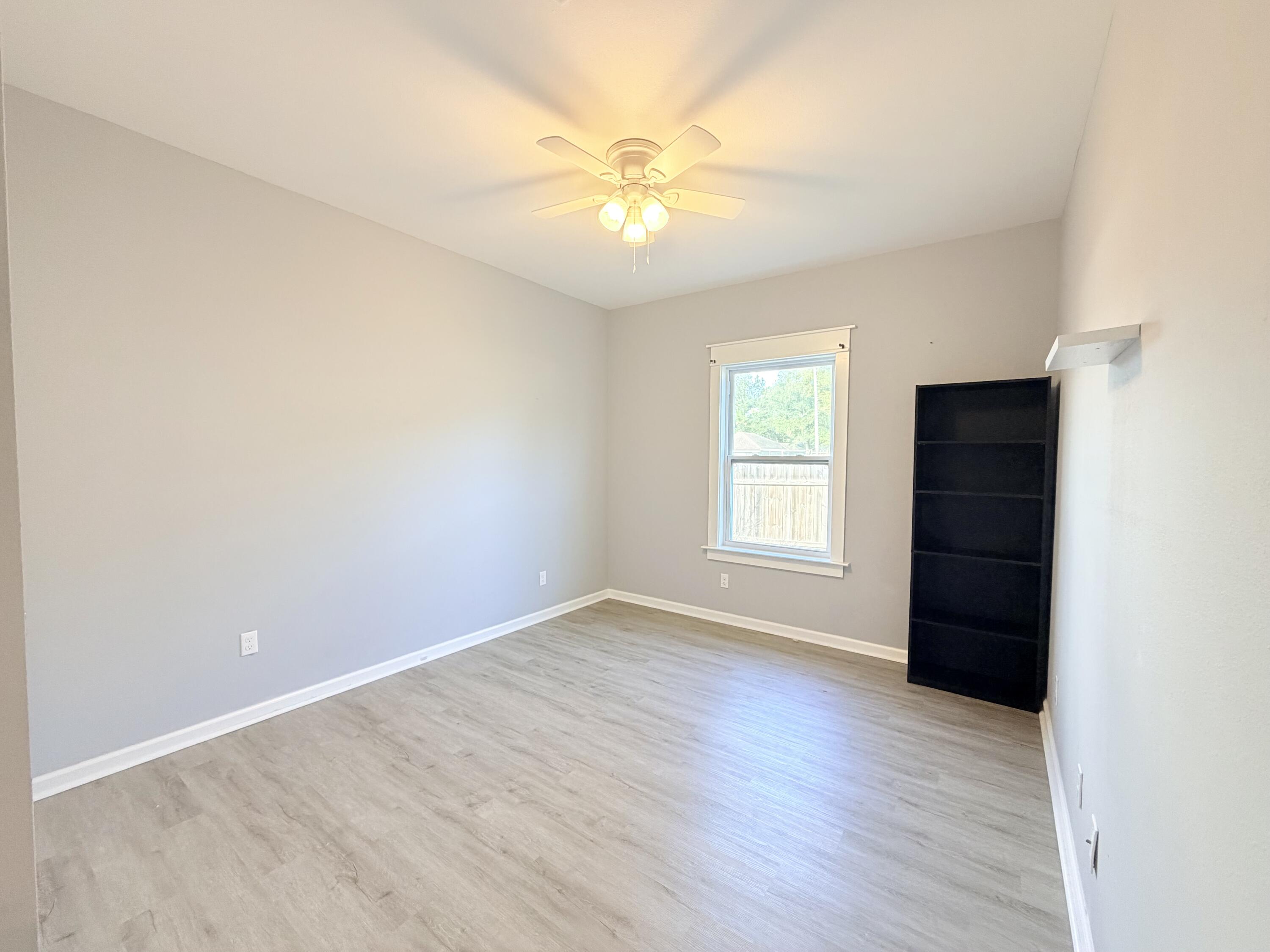 122 Loblolly Circle Midway, FL 32343 - Photo 31 of 38 an empty room with wooden floor closet and windows