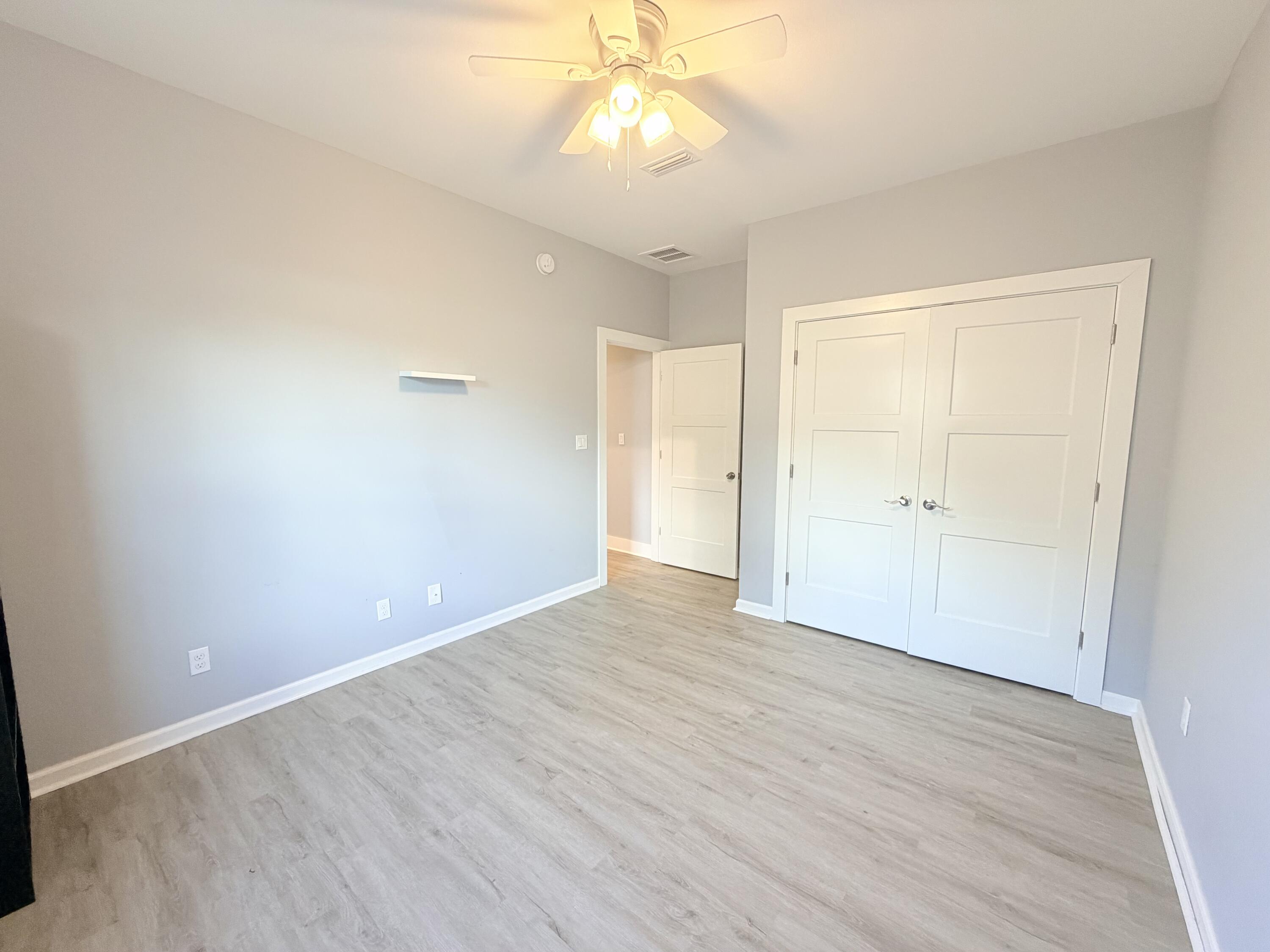 122 Loblolly Circle Midway, FL 32343 - Photo 32 of 38 wooden floor in an empty room with a window