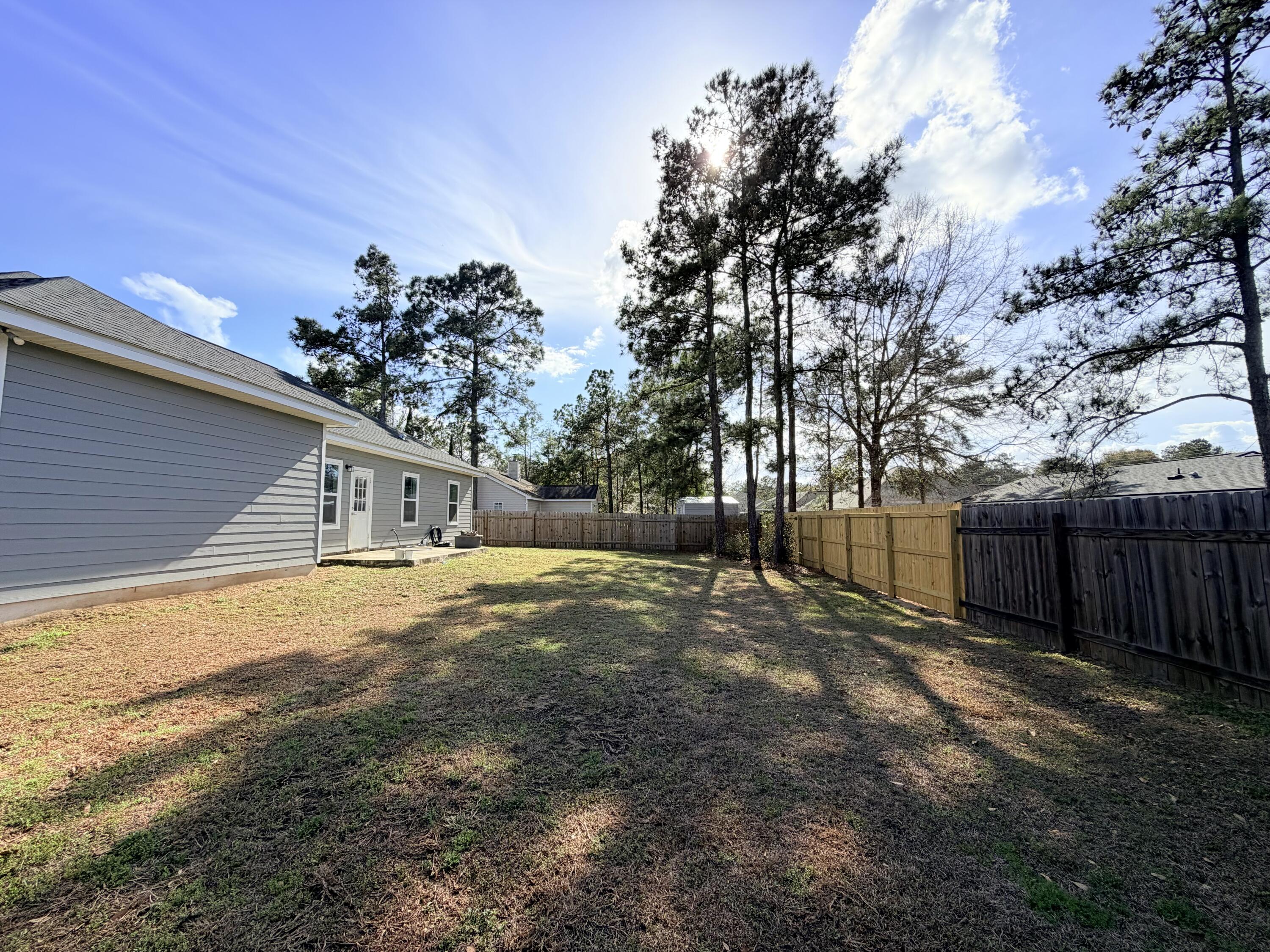 122 Loblolly Circle Midway, FL 32343 - Photo 36 of 38 a front view of a house with a yard and garage