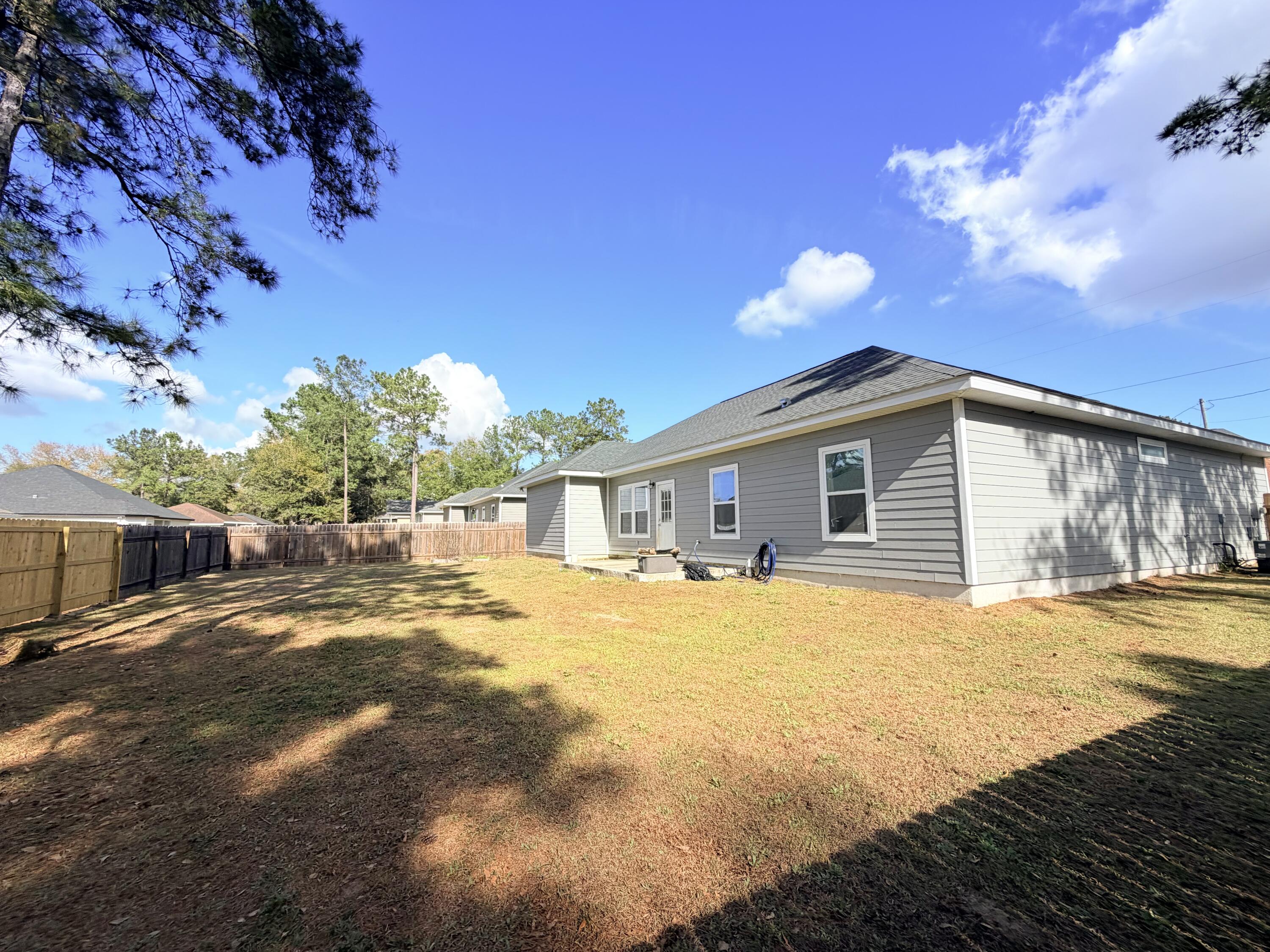 122 Loblolly Circle Midway, FL 32343 - Photo 37 of 38 a view of a house with backyard and sitting area
