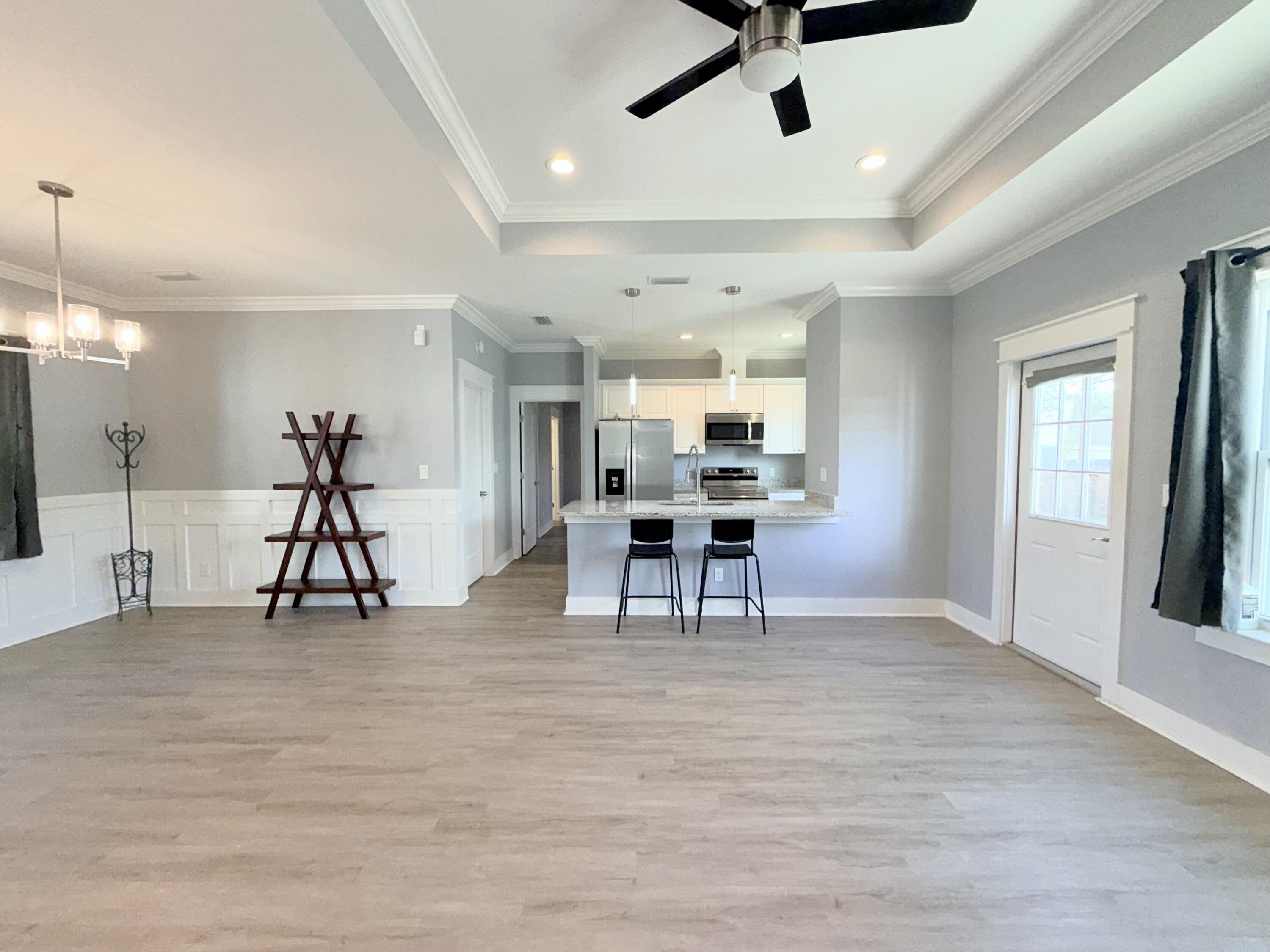 122 Loblolly Circle Midway, FL 32343 - Photo 8 of 38 a view of a room with furniture and wooden floor