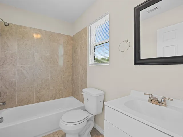 a bathroom with a sink a toilet and a bathtub