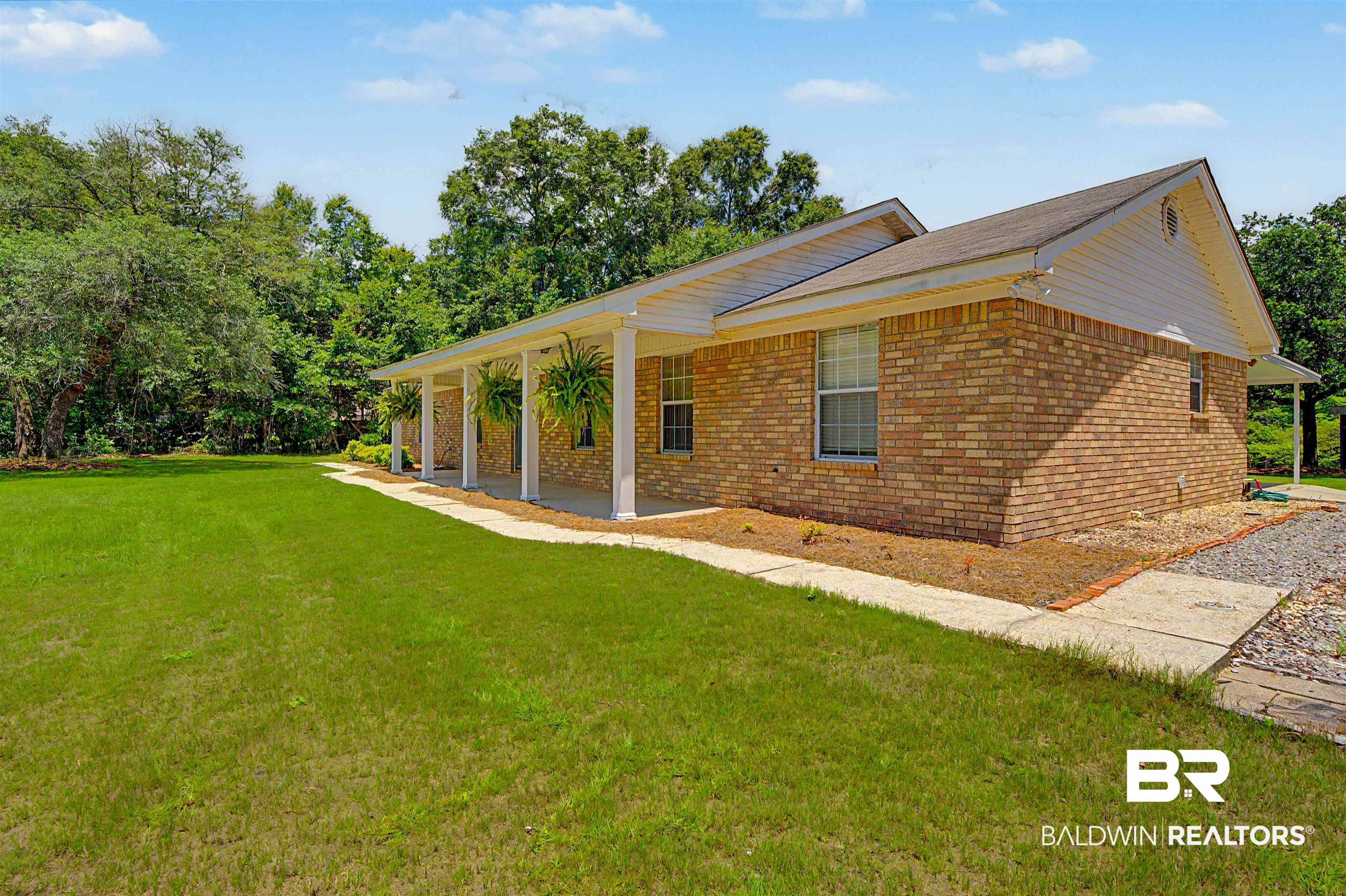 22963 Highway 98 Foley, AL 36535 - Photo 4 of 52 Brick exterior with a covered front porch featuring white columns