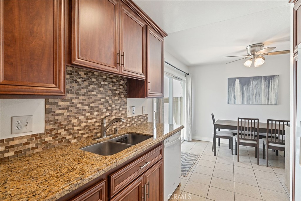 329 Surry Court Brea, CA 92821 - Photo 17 of 47 a kitchen with granite countertop a sink a stove and cabinets