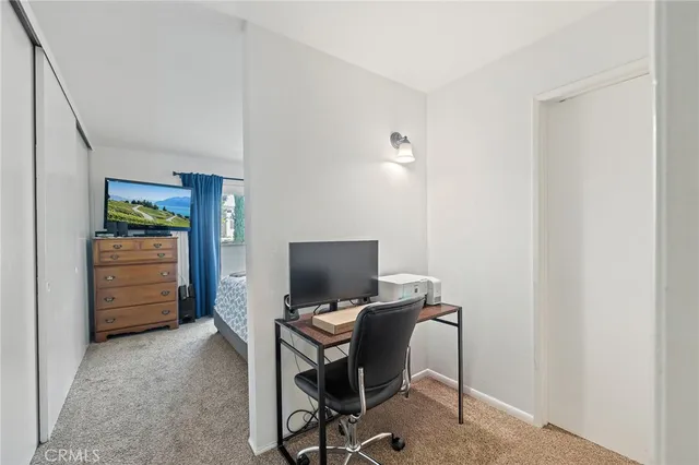 a view of a workspace with furniture