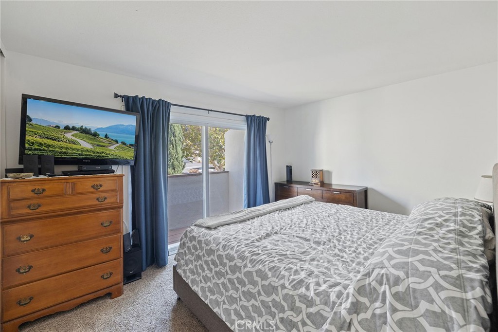 329 Surry Court Brea, CA 92821 - Photo 24 of 47 a bedroom with a bed and a flat screen tv