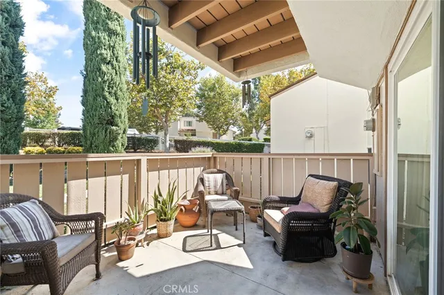 a view of balcony with furniture