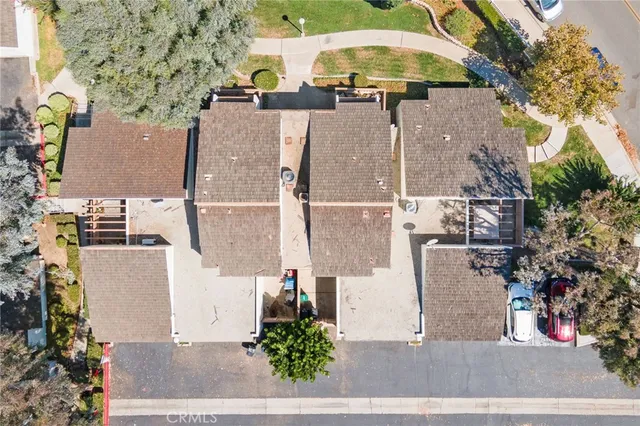 an aerial view of a house with outdoor space