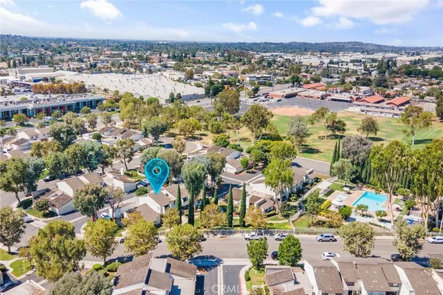 an aerial view of residential houses with outdoor space