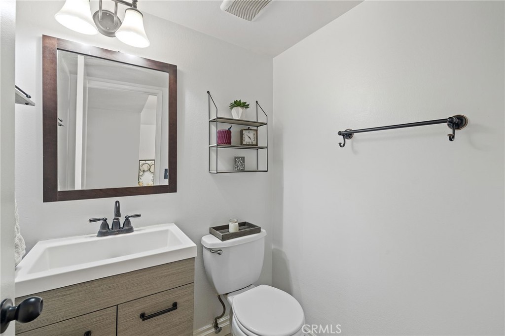 329 Surry Court Brea, CA 92821 - Photo 9 of 47 a bathroom with a sink vanity mirror and toilet