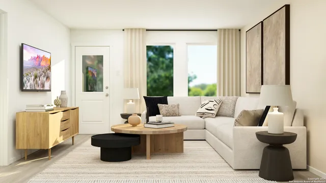 a living room with furniture and a large window