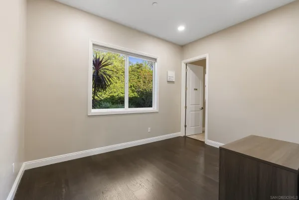 a view of an empty room with a window