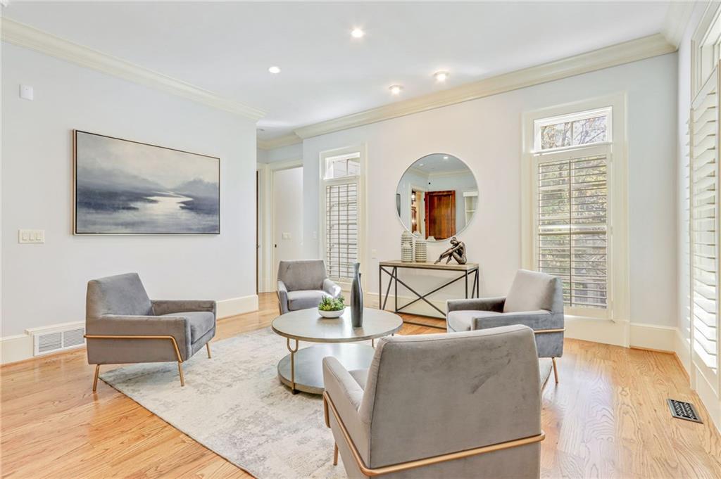 4227 Peachtree Dunwoody Road Atlanta, GA 30342 - Photo 12 of 44 a living room with furniture and a wooden floor