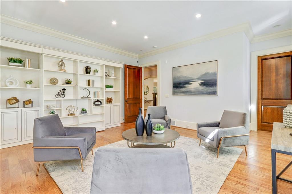 4227 Peachtree Dunwoody Road Atlanta, GA 30342 - Photo 13 of 44 a living room with furniture and wooden floor