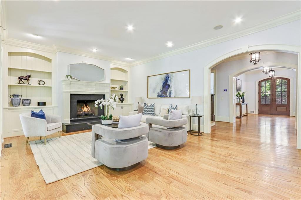 4227 Peachtree Dunwoody Road Atlanta, GA 30342 - Photo 15 of 44 a living room with furniture and a fireplace