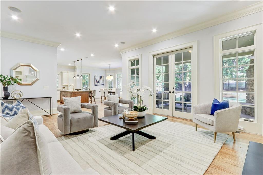 4227 Peachtree Dunwoody Road Atlanta, GA 30342 - Photo 16 of 44 a living room with furniture and floor to ceiling windows