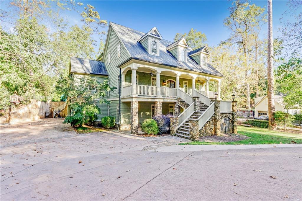 4227 Peachtree Dunwoody Road Atlanta, GA 30342 - Photo 2 of 44 a front view of a house with a yard