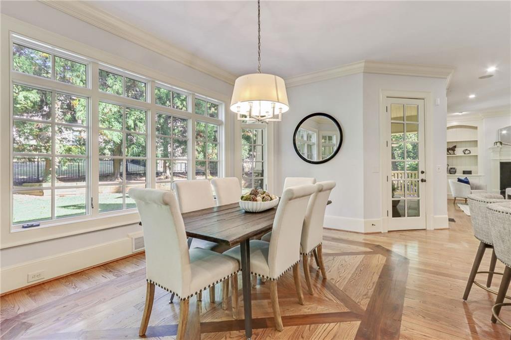 4227 Peachtree Dunwoody Road Atlanta, GA 30342 - Photo 21 of 44 a view of a dining room with furniture window and wooden floor