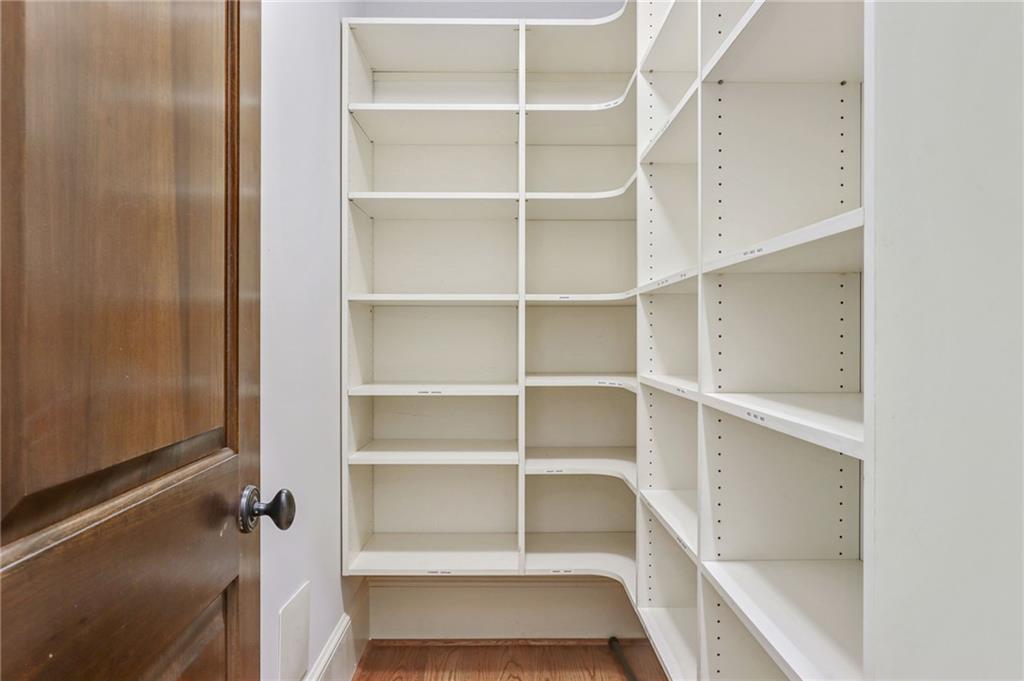 4227 Peachtree Dunwoody Road Atlanta, GA 30342 - Photo 22 of 44 a view of walk in closet with empty racks