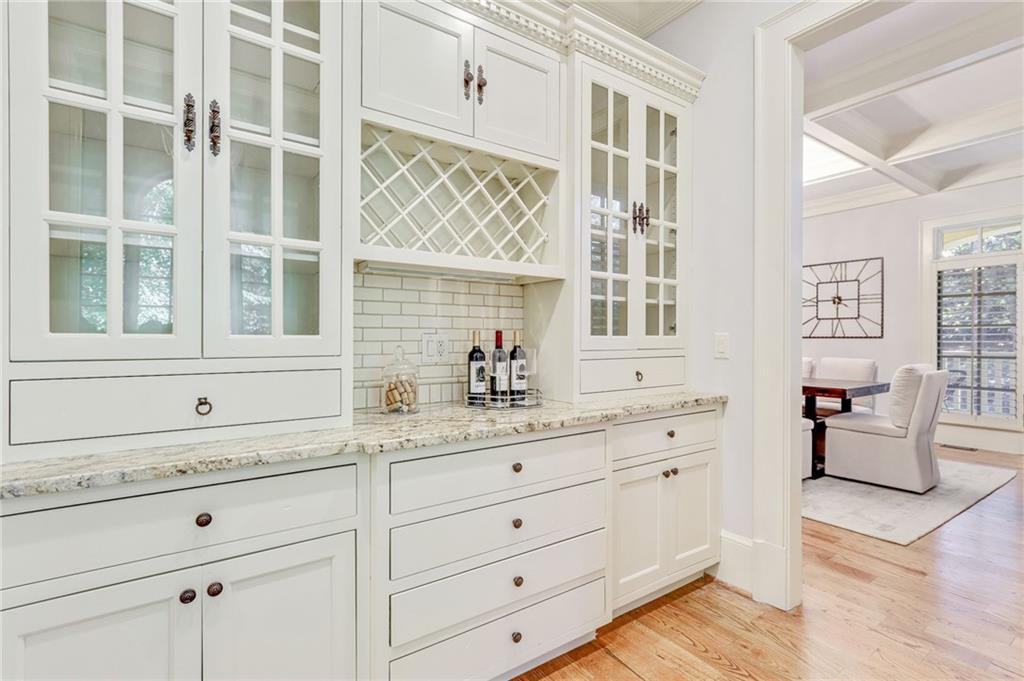 4227 Peachtree Dunwoody Road Atlanta, GA 30342 - Photo 23 of 44 a bathroom with a granite countertop sink mirror and window