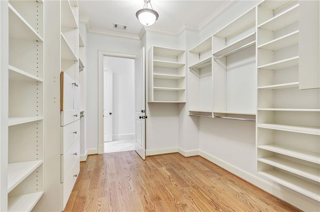 4227 Peachtree Dunwoody Road Atlanta, GA 30342 - Photo 29 of 44 a view of walk in closet with empty racks
