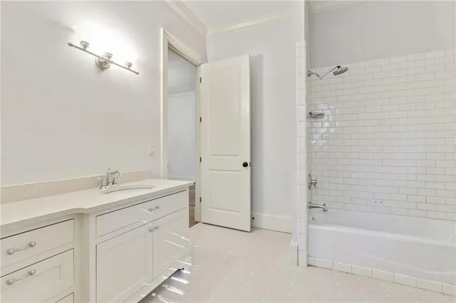 a bathroom with a granite countertop sink a toilet and shower