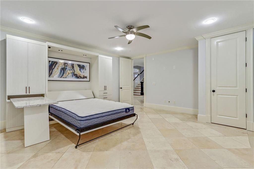 4227 Peachtree Dunwoody Road Atlanta, GA 30342 - Photo 39 of 44 a room with pool table and paintings on the wall