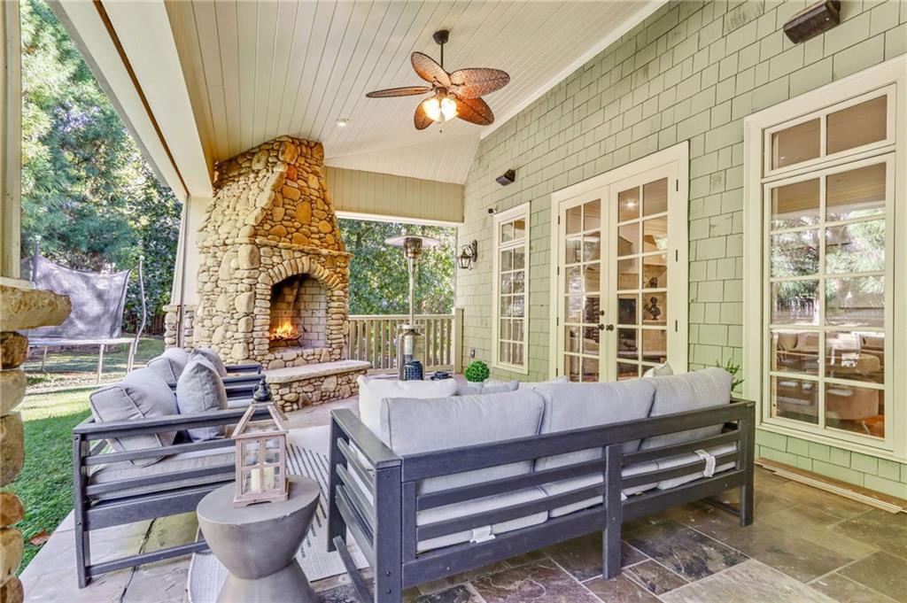 4227 Peachtree Dunwoody Road Atlanta, GA 30342 - Photo 41 of 44 a living room with furniture a fireplace and a large window