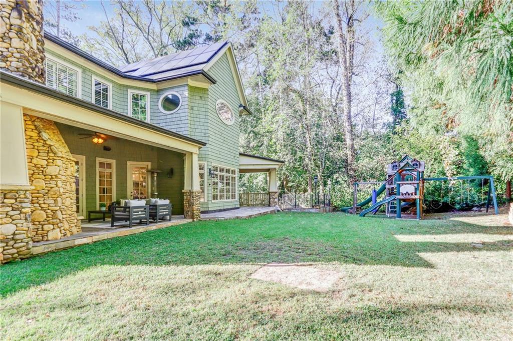 4227 Peachtree Dunwoody Road Atlanta, GA 30342 - Photo 44 of 44 a view of a house with a yard and sitting area