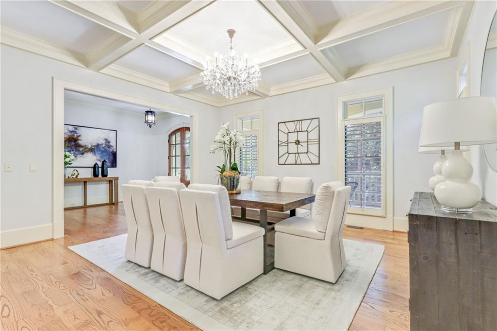 4227 Peachtree Dunwoody Road Atlanta, GA 30342 - Photo 7 of 44 a living room with furniture and a chandelier