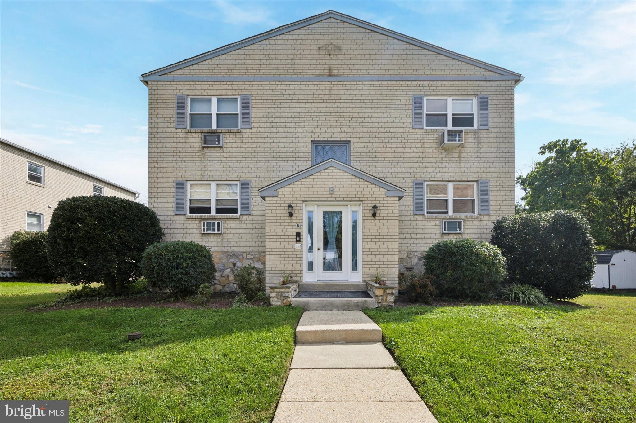 354 South Swarthmore Avenue, Unit B3 Swarthmore, PA 19081 - Photo 1 of 25 a front view of a house with a garden