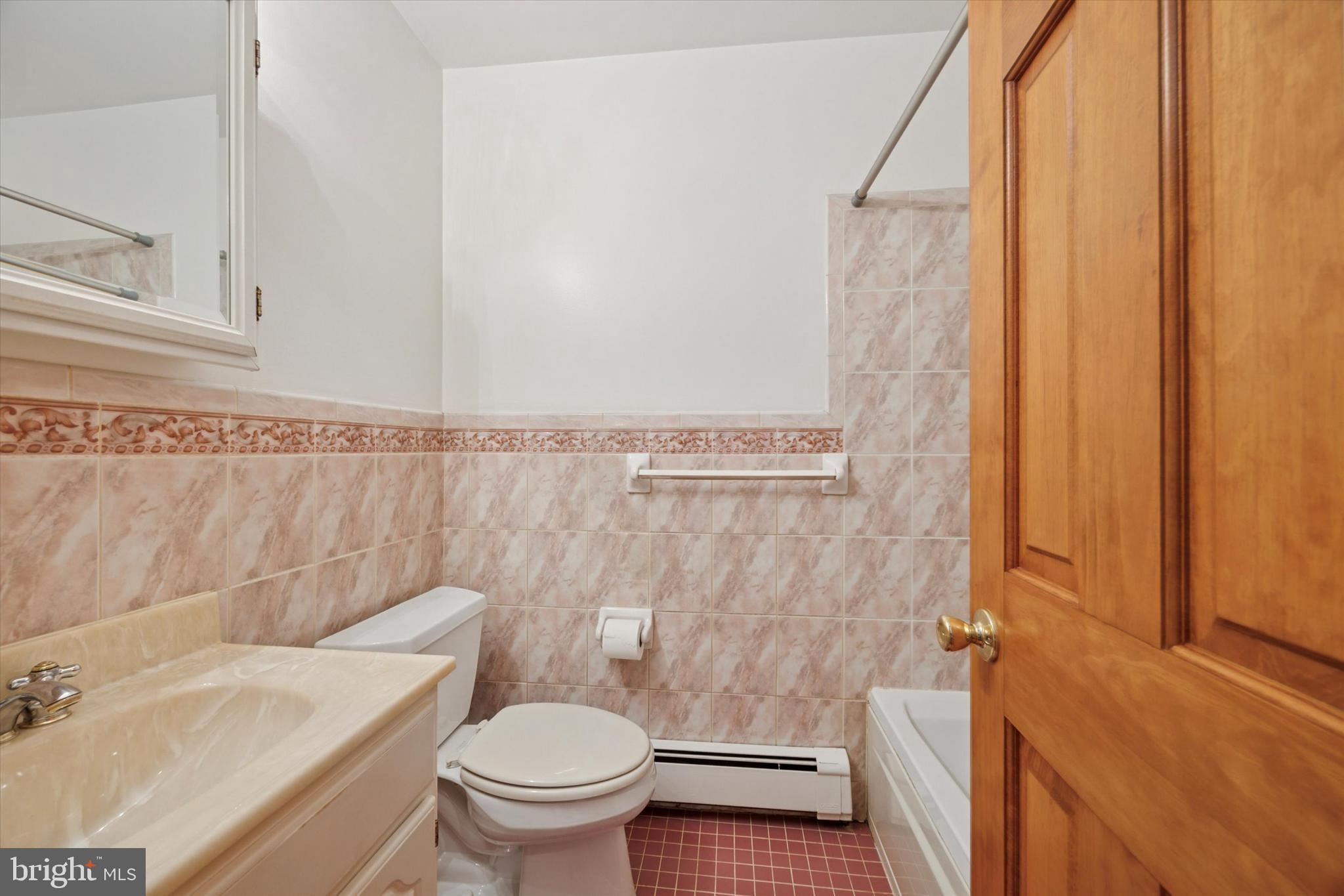 354 South Swarthmore Avenue, Unit B3 Swarthmore, PA 19081 - Photo 16 of 25 a bathroom with a sink and a toilet