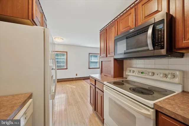 a kitchen with a stove and a microwave