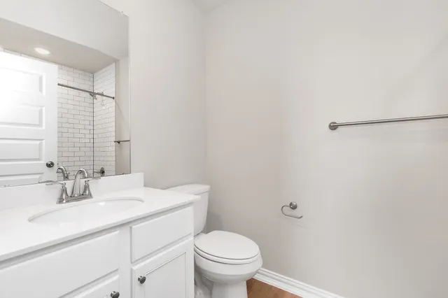 a bathroom with a double vanity sink and mirror