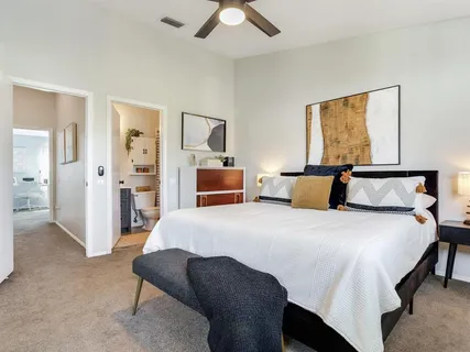 a bedroom with bed and window