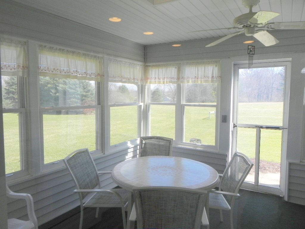 567 Baintree Road Lake Summerset, IL 61019 - Photo 20 of 25 a dining room with furniture a chandelier and wooden floor