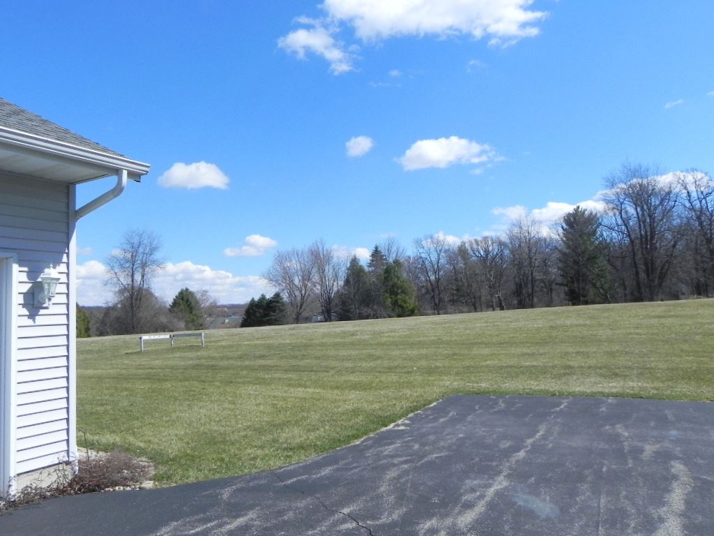 567 Baintree Road Lake Summerset, IL 61019 - Photo 4 of 25 a view of a golf course with a big yard