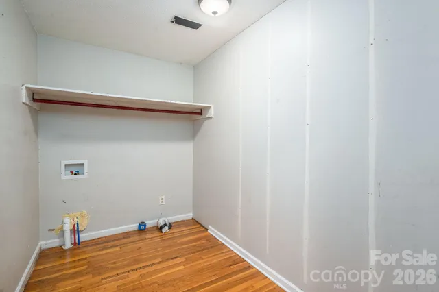 a view of an empty room with stairs