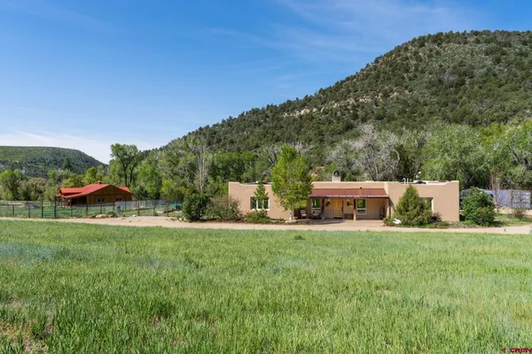 a view of a house with a big yard
