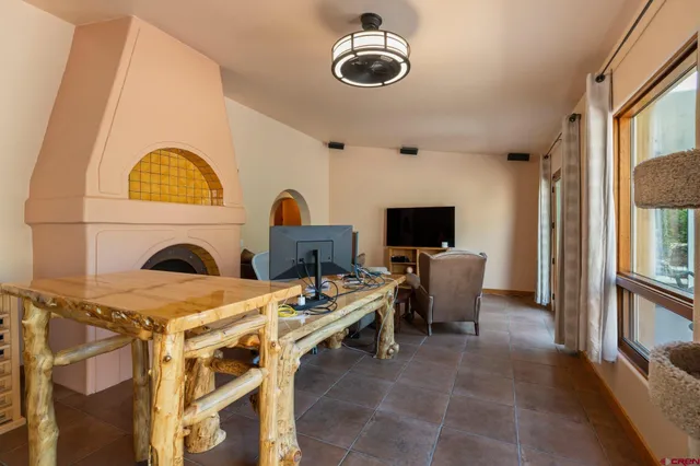 a view of a livingroom with furniture and a fireplace