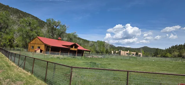 a view of a swimming pool with a yard