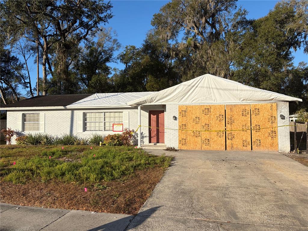 732 Mockingbird Lane DeLand, FL 32720 - Photo 1 of 1 a front view of a house with a yard